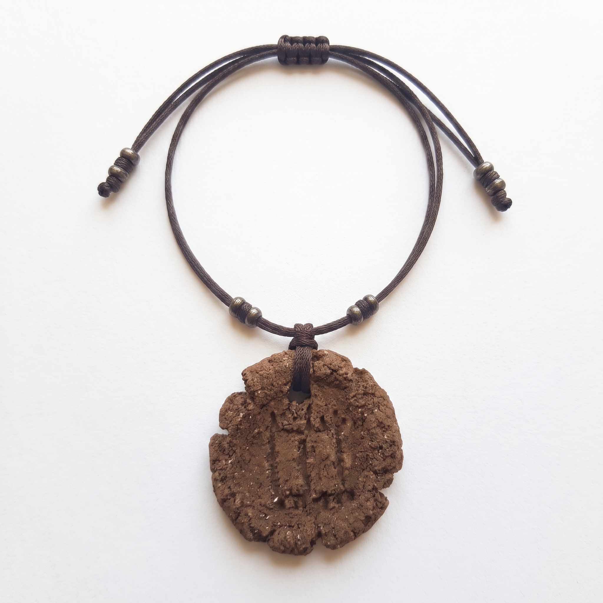 Colgante de Barro Pintadera Podomorfos